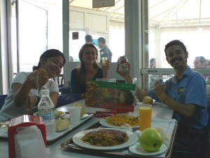 Cafeteria advertisement. I had shrimp, chips and paella. Milena had salad and yoghurt. Mateo is holding a can of Cruz Campo. Martin’s plate shows salchichas and paella.